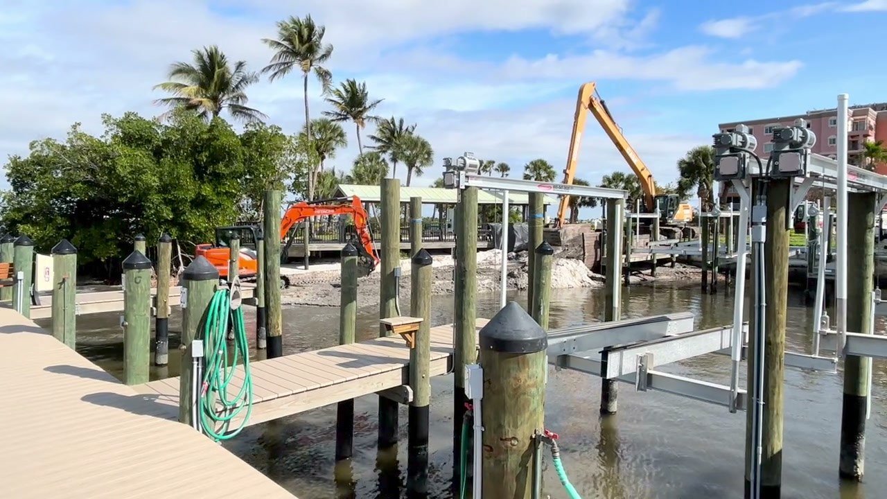 Dock & Dredge: docks, boat-lift components and excavator equipment by the water